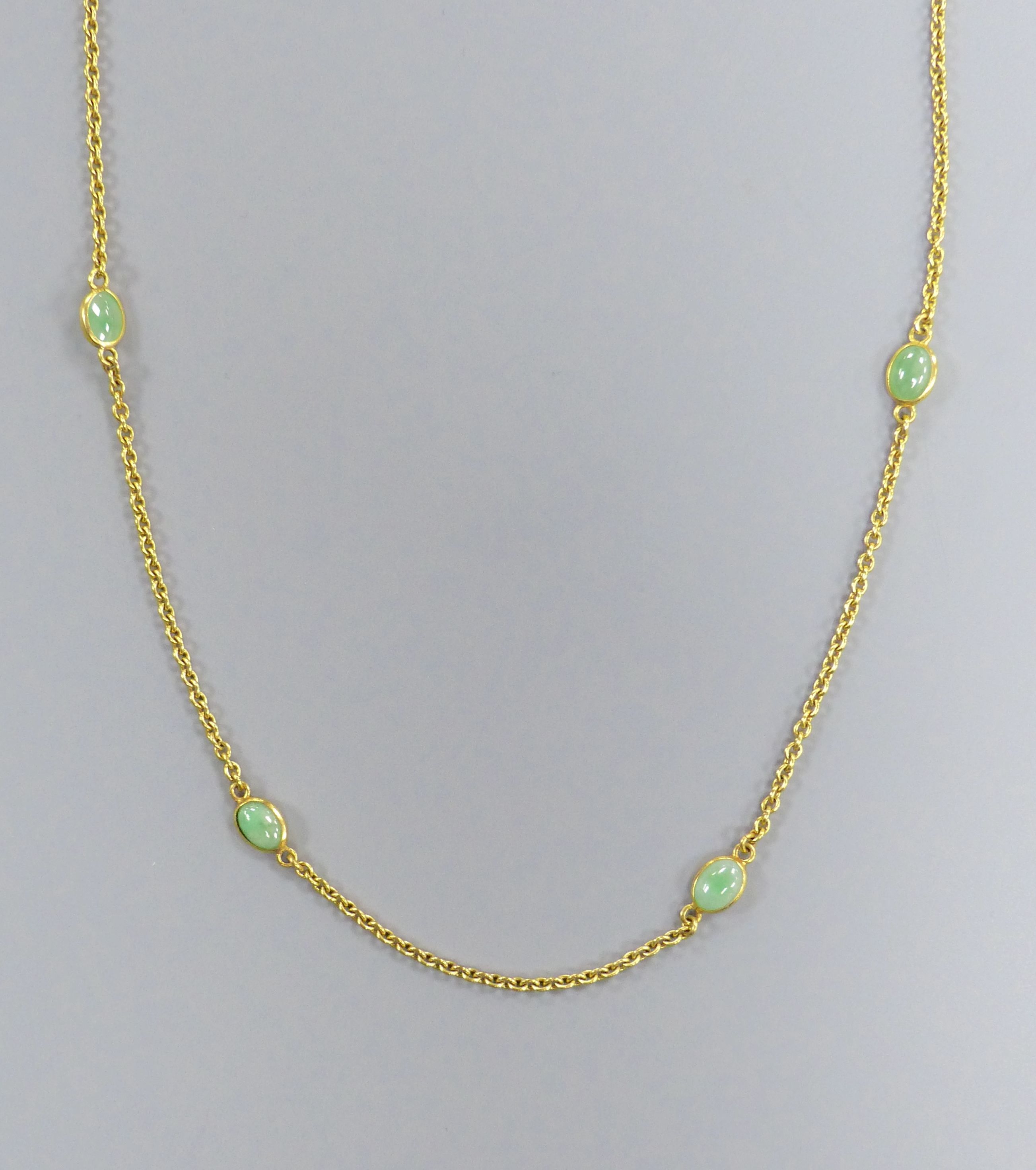 A modern 9ct gold and eight stone cabochon jade set 'spectacle' necklace, 60cm,